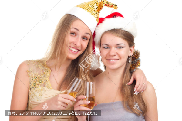 兩個(gè)女孩用手拿禮物和眼鏡慶祝圣誕節(jié)