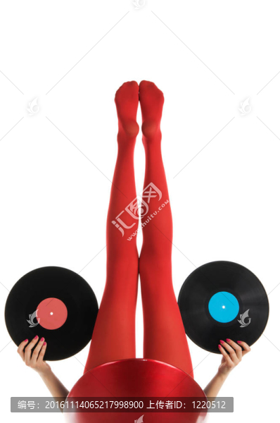 女性腳在紅色長襪與乙烯基記錄