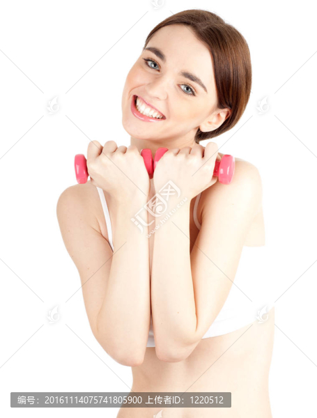 年輕女子穿白色內(nèi)衣與粉紅色健身重量