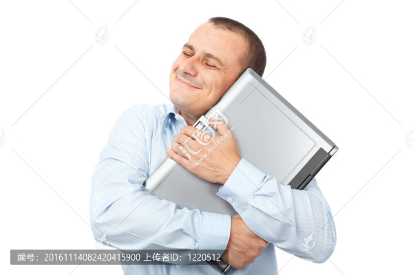 快樂的商人拿著他的筆記本電腦