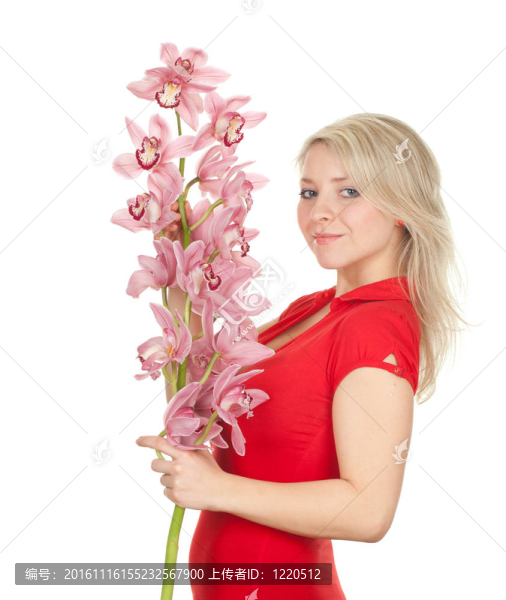 微笑美麗的年輕女子與粉紅色蘭花
