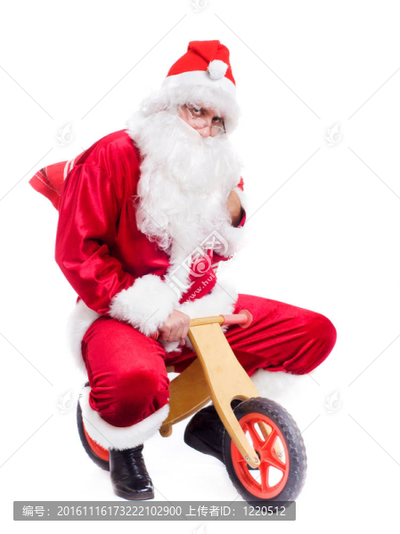 快樂圣誕老人在自行車上的照片