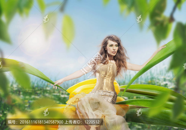 坐在郁金香上的美麗的年輕女士