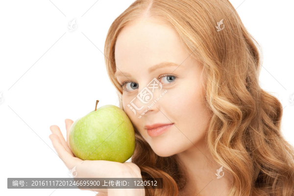 年輕美麗的女人和綠色的蘋果