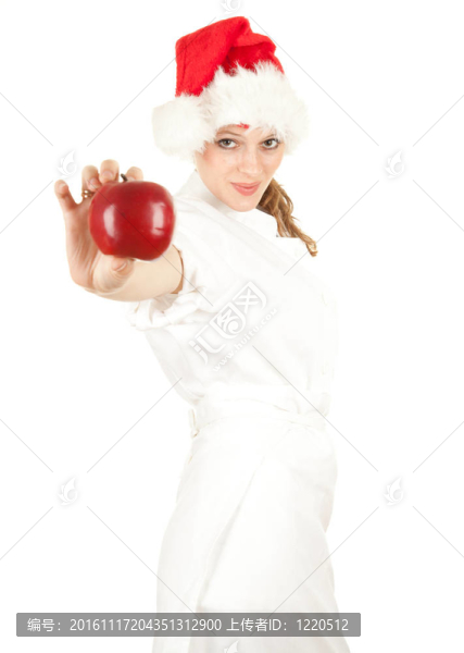 Santa女廚師白色制服和紅色圣誕帽與蘋果