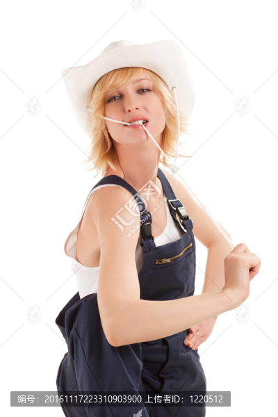性感的女牛仔在一頂牛仔草帽