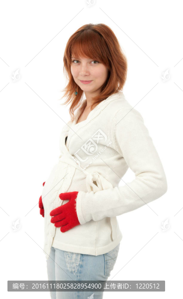 美麗的懷孕女孩把手放在肚子上