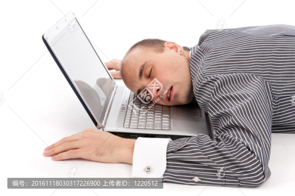商人睡在筆記本電腦上