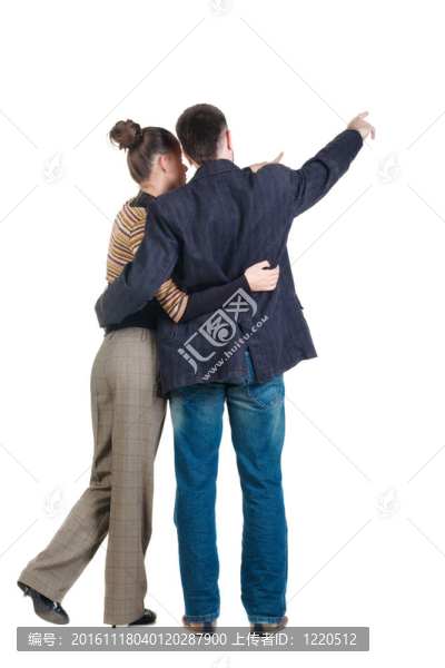 指著墻的年輕夫婦。后視圖。白色背景隔離。