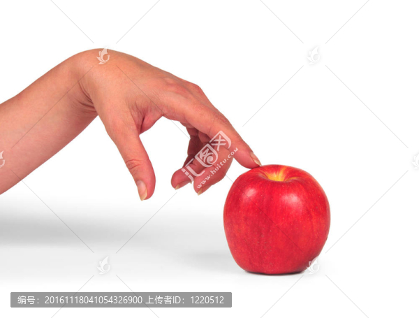 它的照片手指出一個紅蘋果