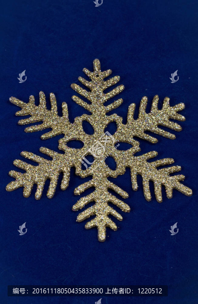 深藍(lán)色背景上的金色雪花