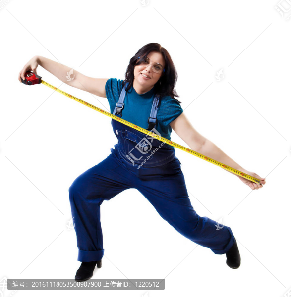 用卷尺穿著工作服的漂亮女人