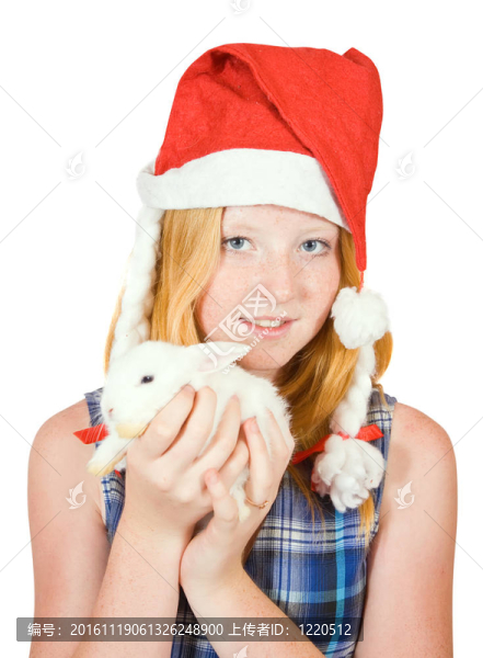 青少年在圣誕老人帽與兔子