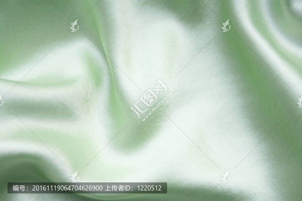 以流暢優(yōu)雅的綠色絲綢為背景