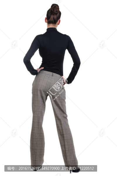 美麗的年輕女人看著墻。后視圖。