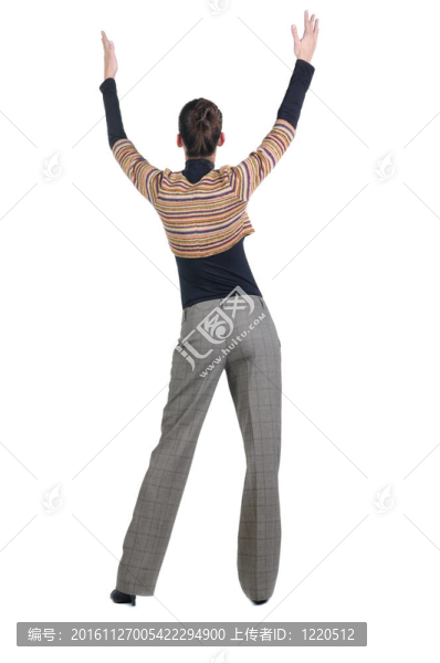 美麗的年輕女子指著墻上。后視圖。