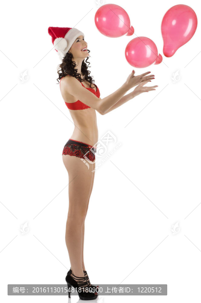性感的圣誕老人克勞斯玩氣球