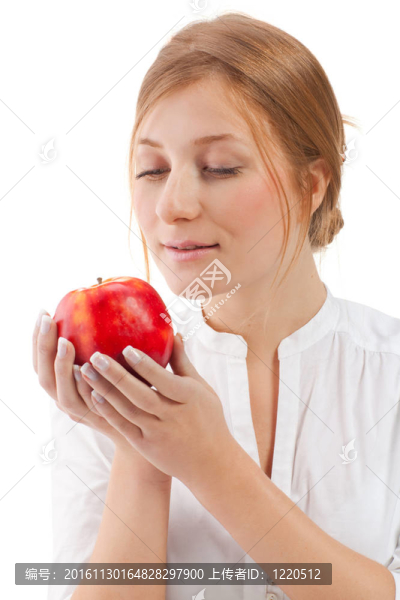 美麗的女人拿著蘋(píng)果