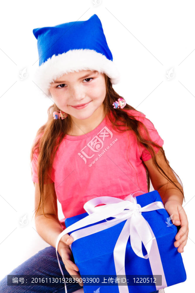 小女孩在Santa的帽子與藍(lán)色禮品盒