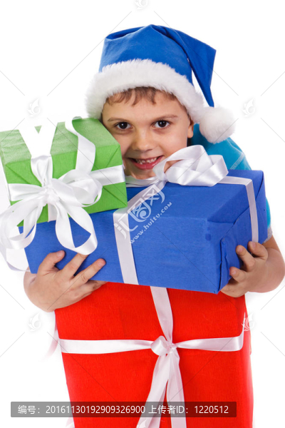 笑小男孩在Santa的帽子與禮品盒