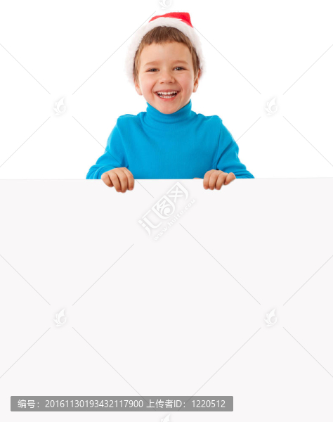微笑的男孩在Santa帽子與空旗幟