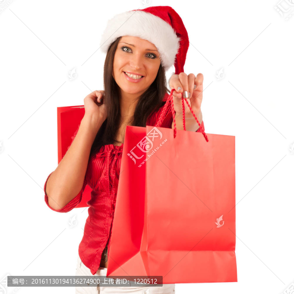 漂亮的女孩穿著像Santa的圣誕禮物