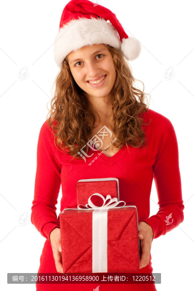 漂亮的女孩穿著像Santa的圣誕禮物