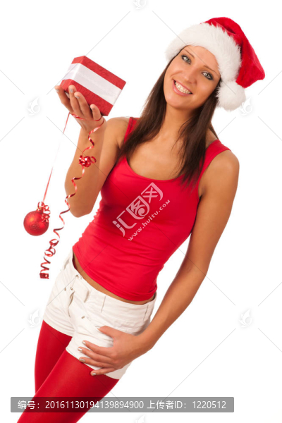 漂亮的女孩穿著像Santa的圣誕禮物