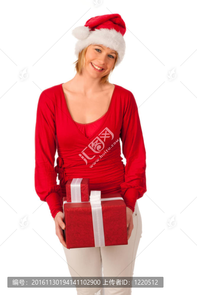 漂亮的女孩穿著像Santa的圣誕禮物