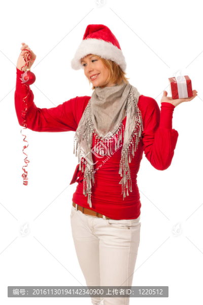漂亮的女孩穿著像Santa的圣誕禮物