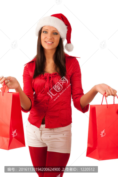 漂亮的女孩穿著像Santa的圣誕禮物