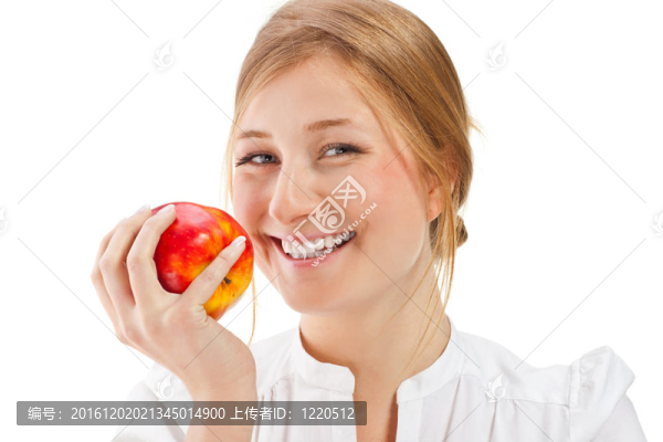 美麗的女人拿著蘋果