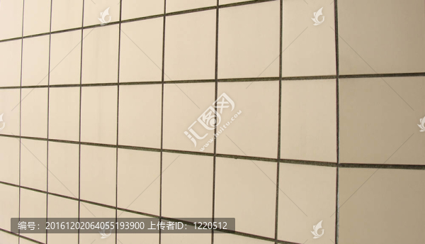 奶油黃色方瓷磚墻背景角