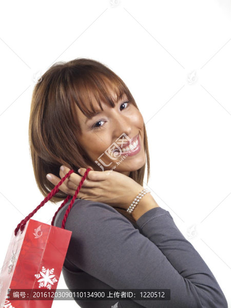 年輕快樂的女人，帶著圣誕禮物