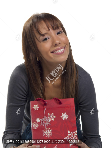 年輕快樂的女人，帶著圣誕禮物