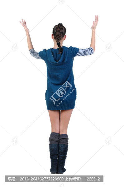 美麗的年輕女子看著墻。后視圖。
