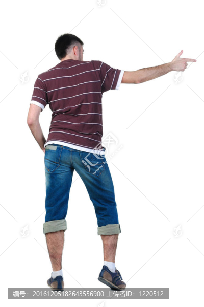 指著墻的年輕人。后視圖。