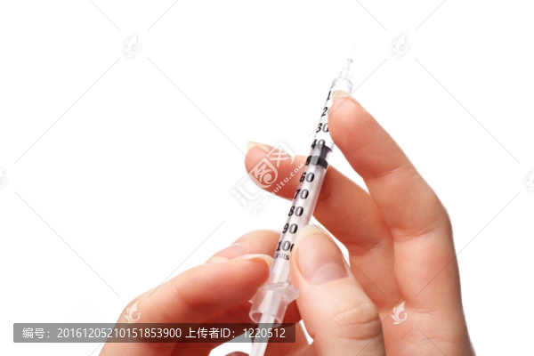 帶注射器的女性手