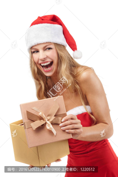 快樂的圣誕婦女拿著Santa的服裝