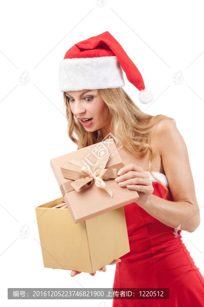 快樂的圣誕婦女拿著Santa的服裝