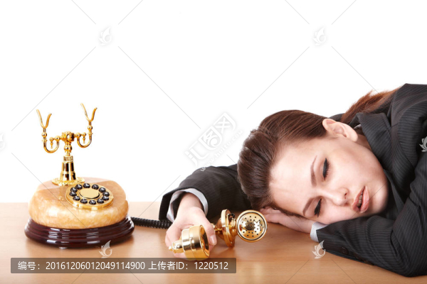 疲憊的商業(yè)婦女與電話。