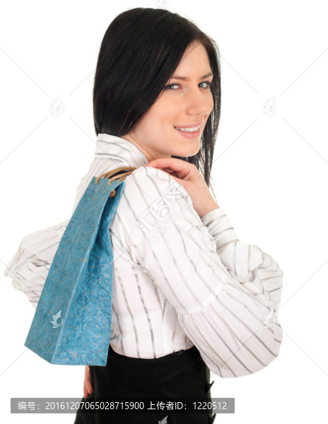 年輕；優(yōu)雅的女人保持藍色的禮物袋