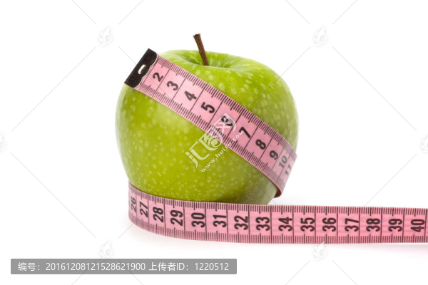 帶卷尺的蘋(píng)果。健康生活理念。