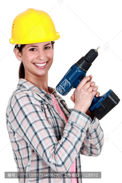 女建筑工人拿著鉆