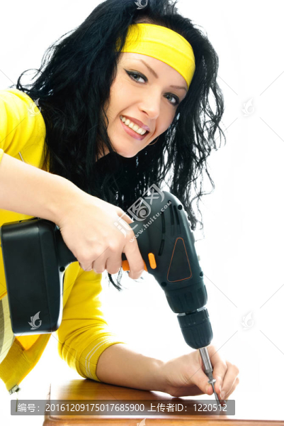 美麗的年輕女子與鉆頭