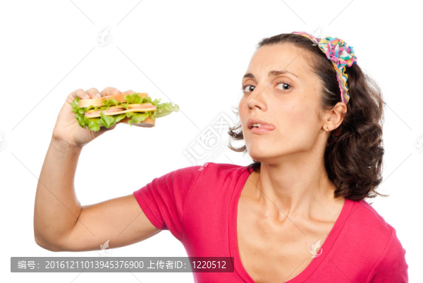 饑餓的漂亮女孩吃三明治