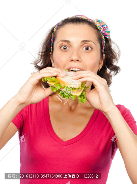 饑餓的漂亮女孩吃三明治