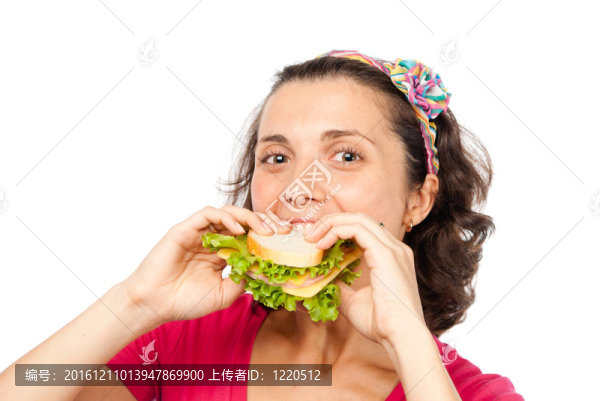 饑餓的漂亮女孩吃三明治