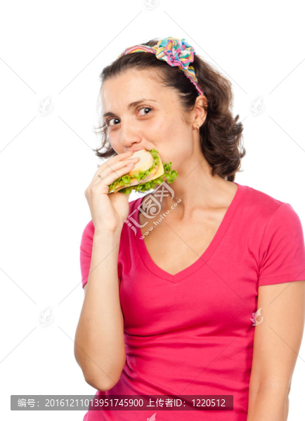 饑餓的漂亮女孩吃三明治