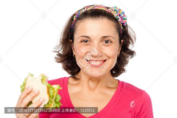 饑餓的漂亮女孩吃三明治
